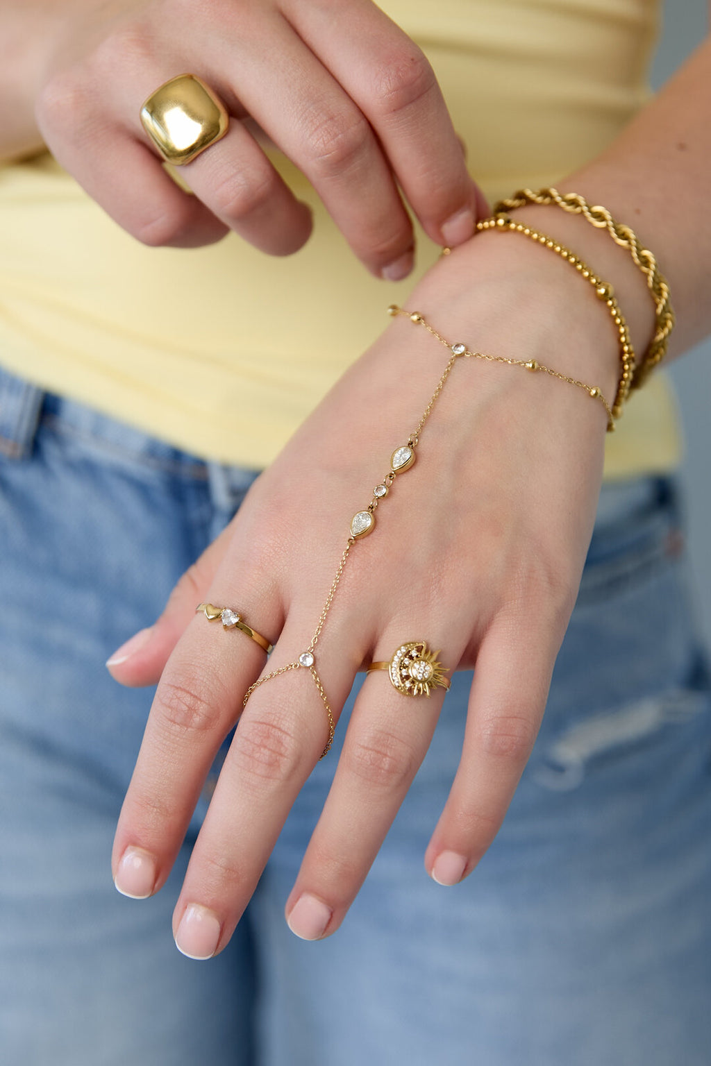 Bracciale a mano con pietre a forma di goccia